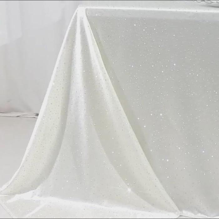 Pearl white tablecloth with rhinestone accents, wrinkle-free and stain-resistant.