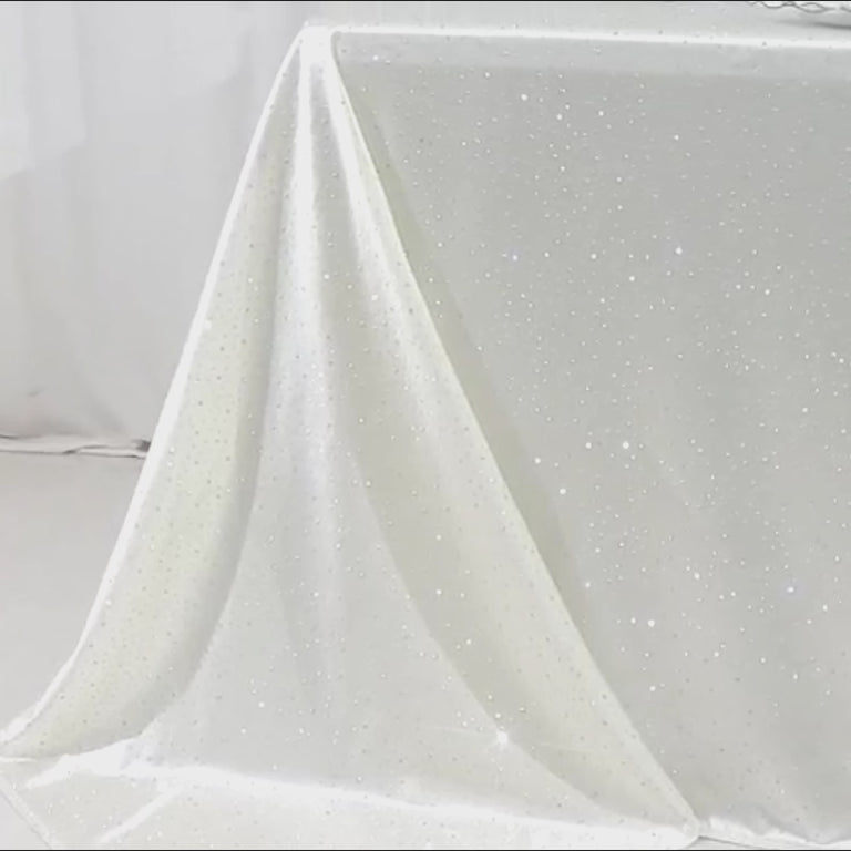 Pearl white tablecloth with rhinestone accents, wrinkle-free and stain-resistant.