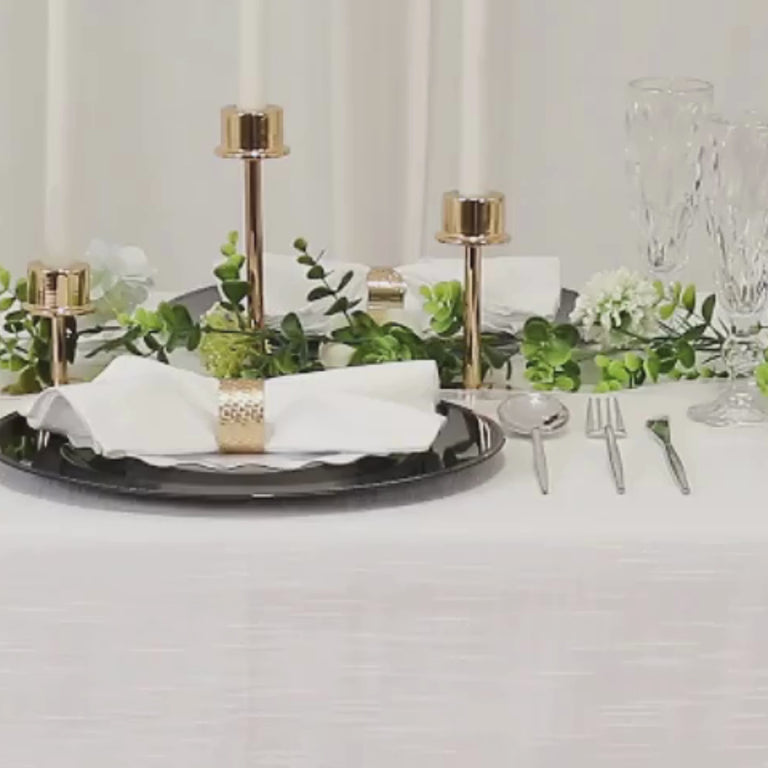 Navy blue beaded rim charger plates on an elegant dining table setting.