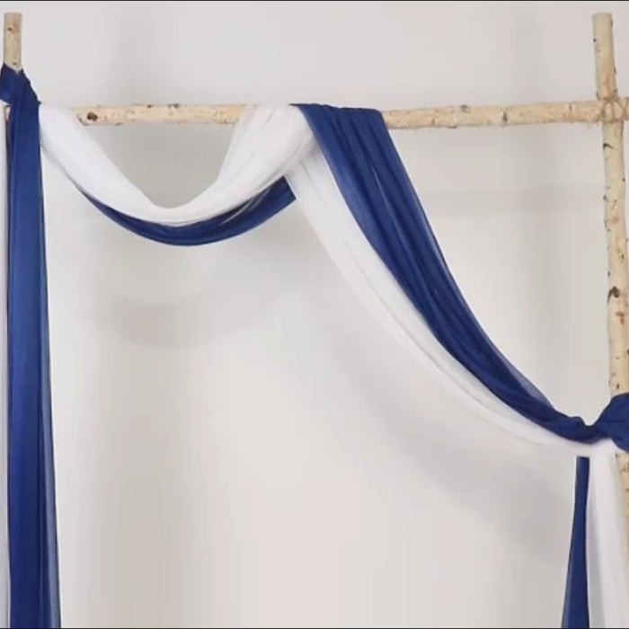 Navy blue sheer wedding arch drape with white accents.