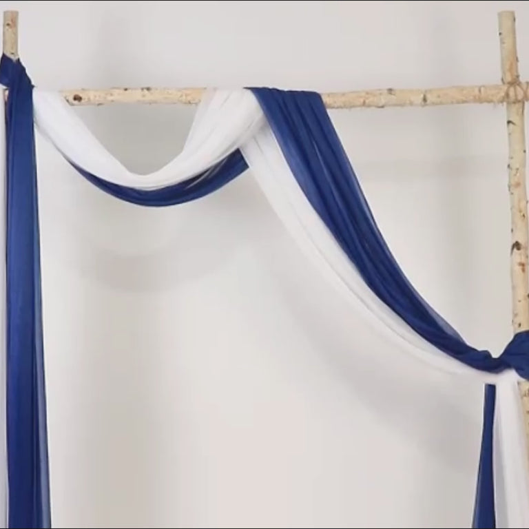 Navy blue sheer wedding arch drape with white accents.