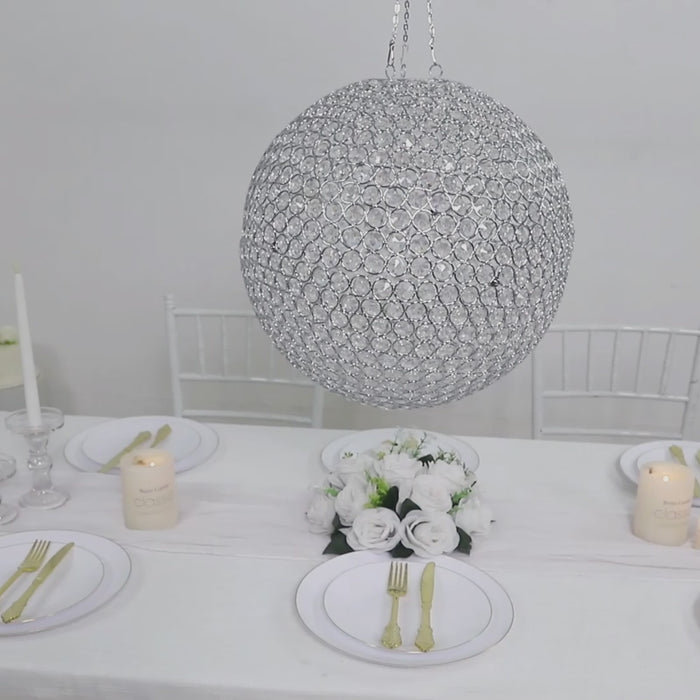 Silver Crystal Globe Chandelier Pendant hanging above a table setting.