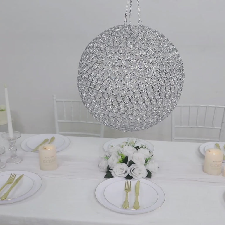 Silver Crystal Globe Chandelier Pendant hanging above a table setting.