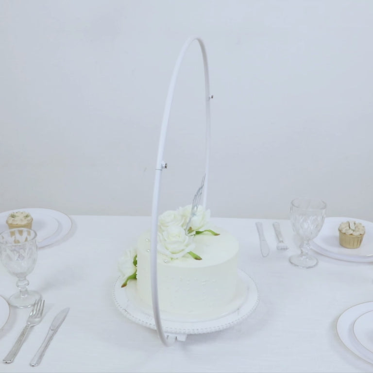 Whitewash metal floral hoop cake stand with beaded wooden base.