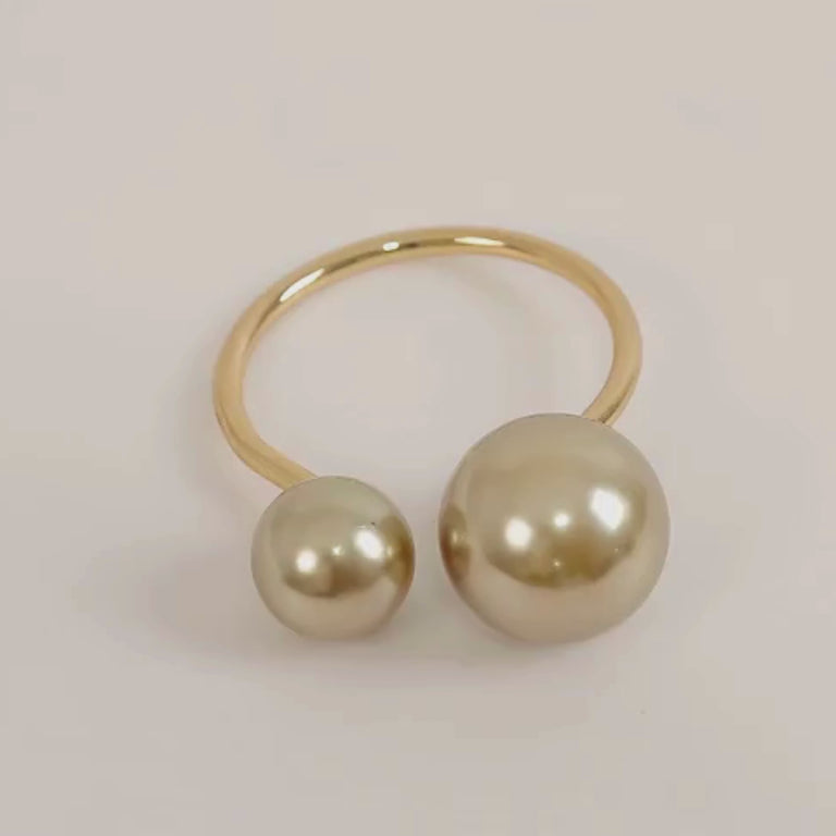 Champagne pearl metal napkin rings for elegant dining table decor.