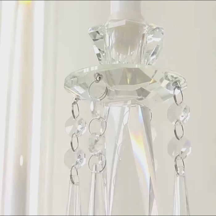 Clear crystal candelabra with hanging accents and hurricane glass shades.