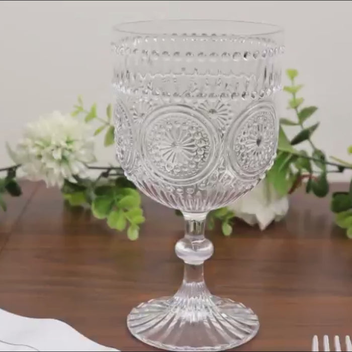 Clear vintage plastic wine goblets with embossed floral pattern, shatterproof.
