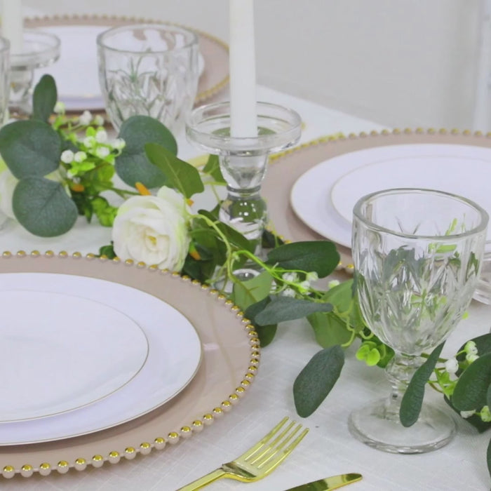 Taupe charger plates with gold beaded rim for stylish dinner parties.