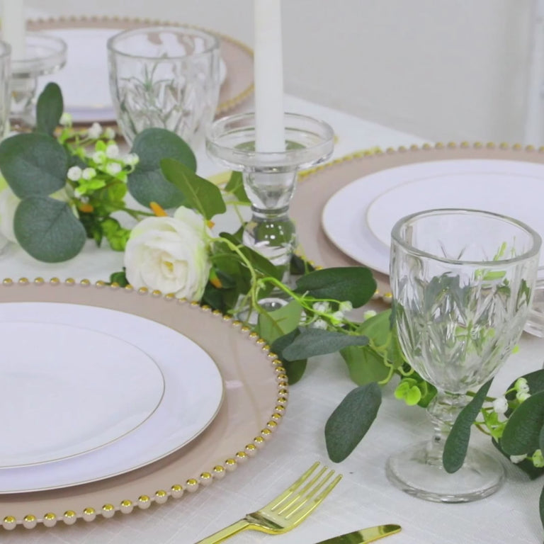 Taupe charger plates with gold beaded rim for stylish dinner parties.