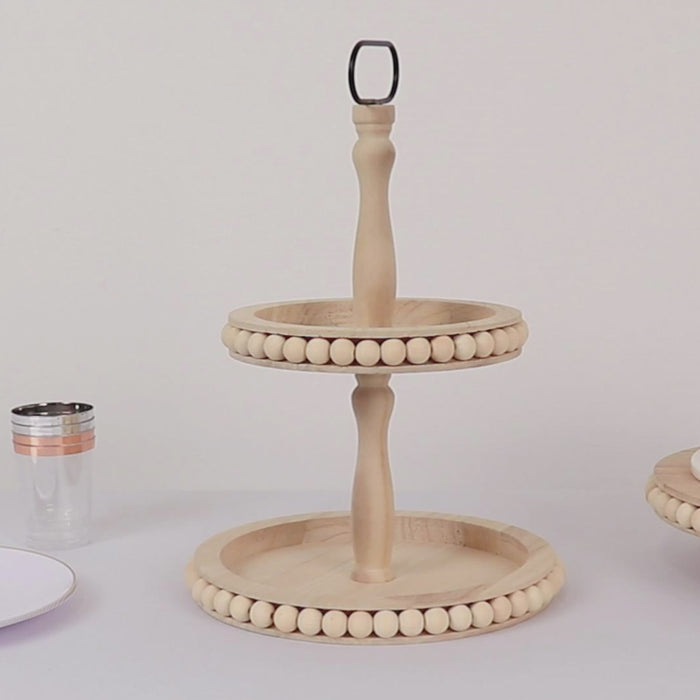 Natural wooden serving tray stand with beaded design and metal handle.