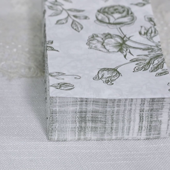 Matte sage green floral dinner napkins in a 50-pack.