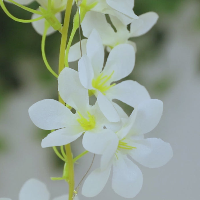 White jasmine flower garland vine lights with warm white fairy lights.