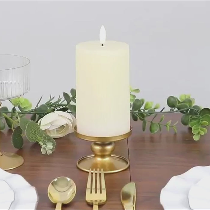 Gold metal candle holders for pillar and taper candles, perfect for elegant decor.
