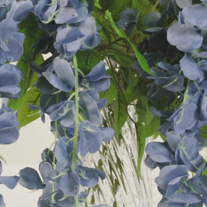 Dusty blue artificial silk wisteria flower garland vines in full strands.