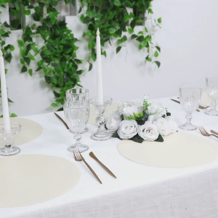 Pearl white disposable paper placemats on a dining table setting.