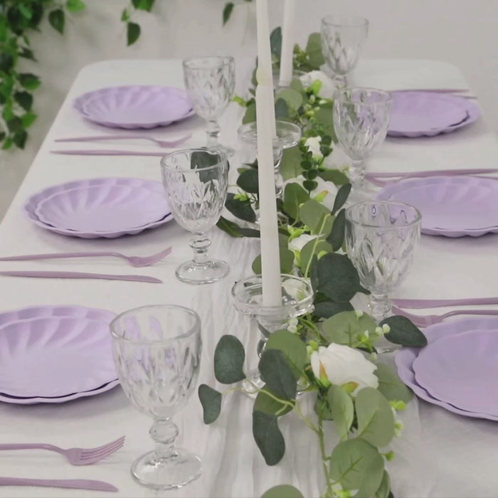 Lavender lilac swirl scalloped compostable dinner plates on a table setting.