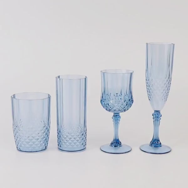 Dusty blue transparent plastic champagne glasses in crystal cut style.