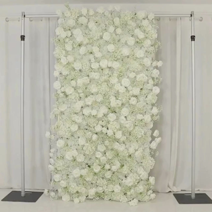 White roll-up flower wall backdrop with artificial silk roses and baby's breath.