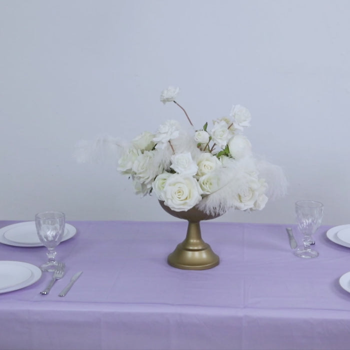 Lavender table cover with elegant floral arrangement on a table setting.