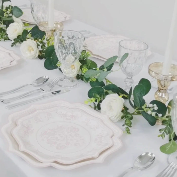 White pink floral disposable dinner plates with scallop rim.