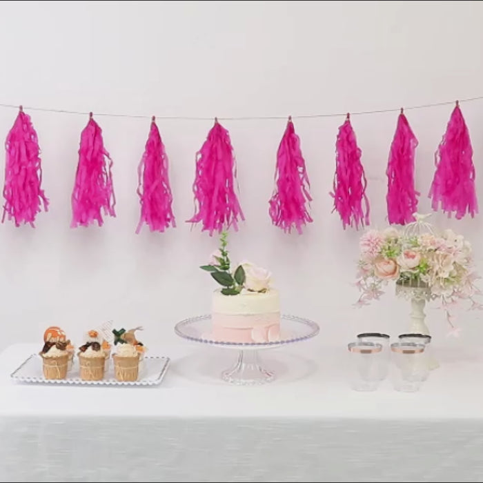 Pre-tied pink tissue paper tassel garland for party décor.