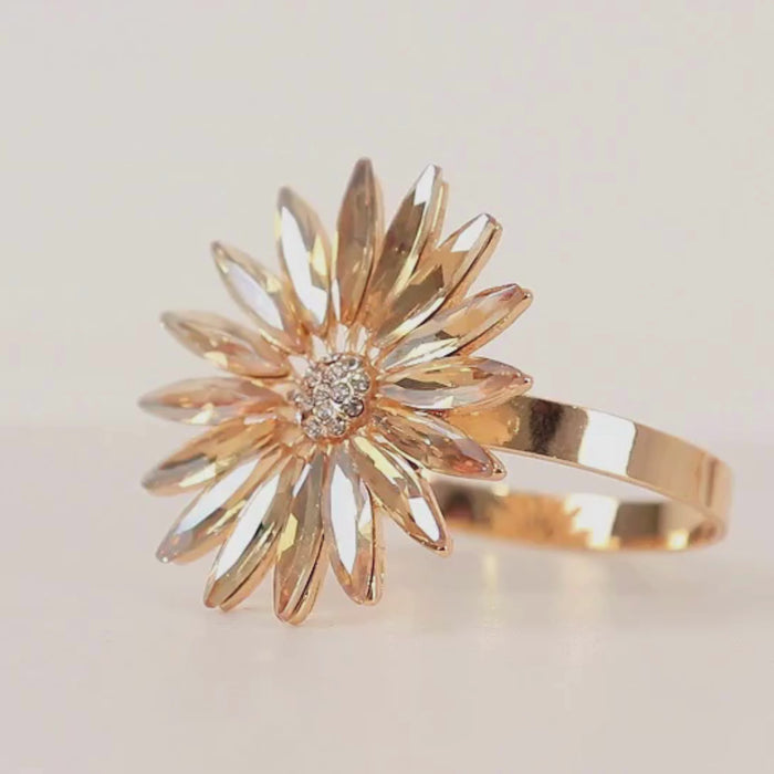 Amber gold daisy floral napkin ring with rhinestone accents.