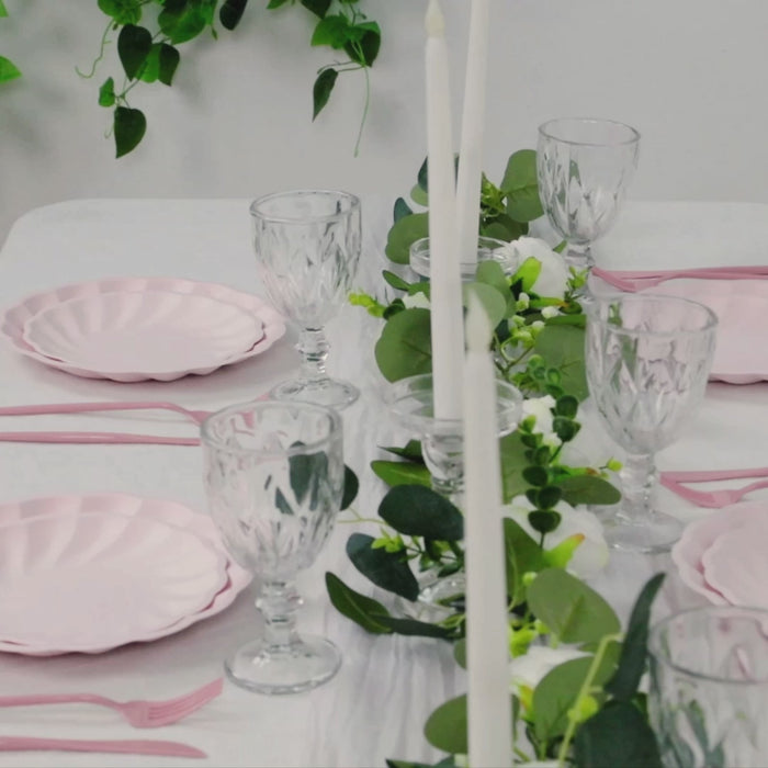 Blush swirl scalloped compostable dinner plates on a party table.