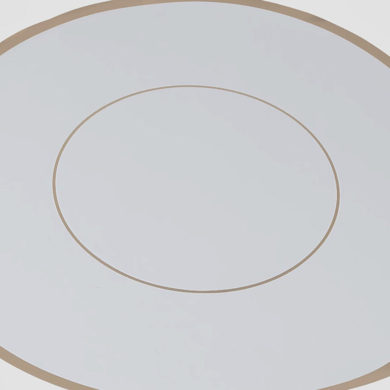 White disposable table placemat with gold rim, 13" round.