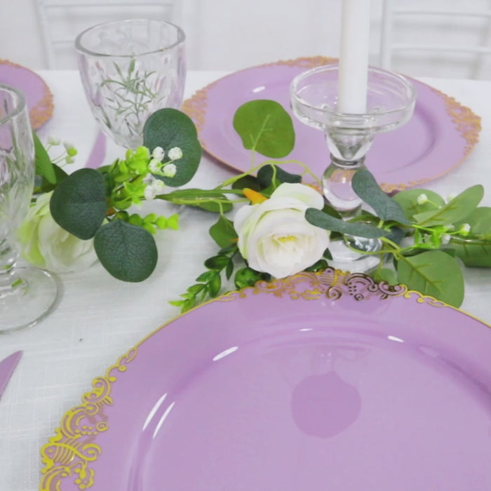 Lavender lilac charger plate with gold embossed rim on a dinner table setting.