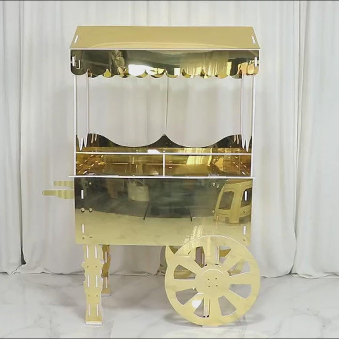 Gold mirrored dessert cart on wheels with shelf for event decor.