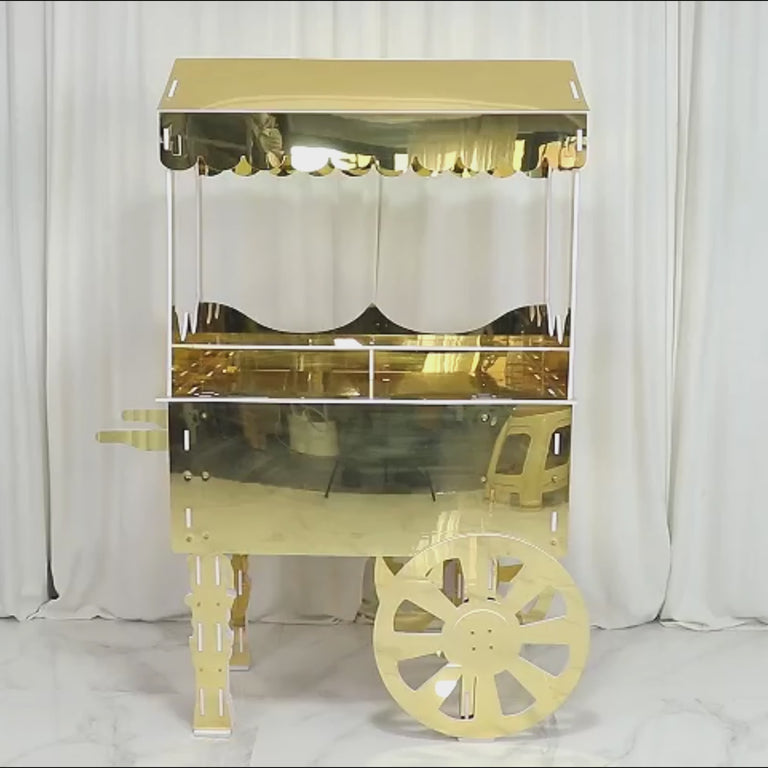 Gold mirrored dessert cart on wheels with shelf for event decor.