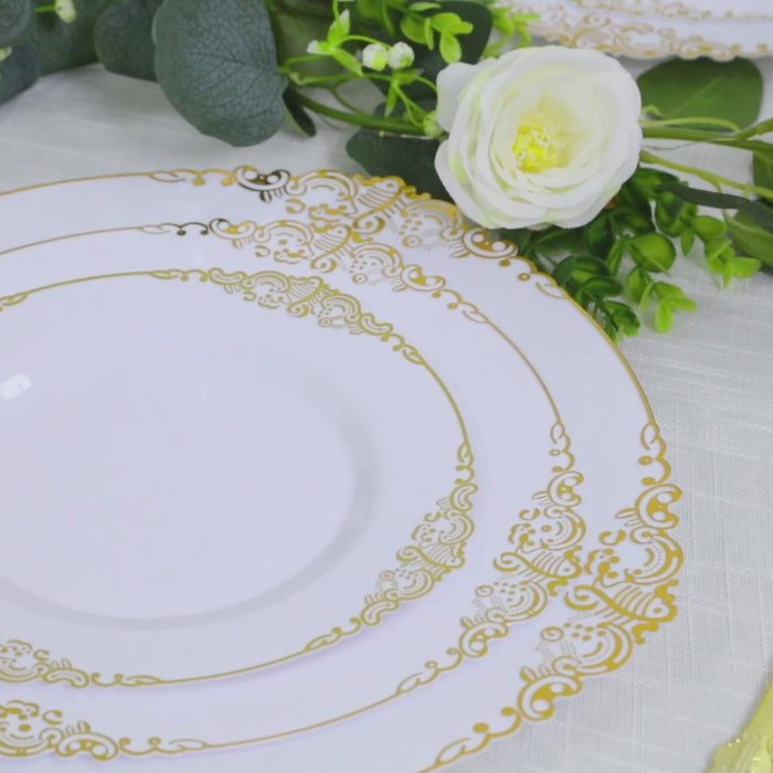 White charger plates with gold embossed baroque rim for elegant dining.