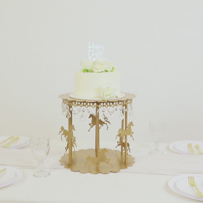 Gold carousel cake stand with hanging acrylic beads for dessert display.