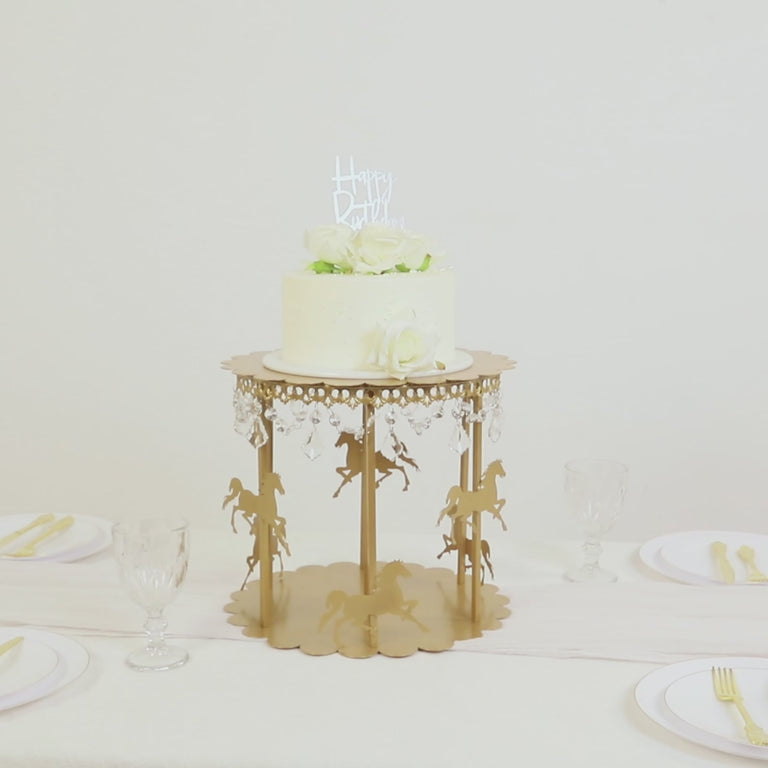 Gold carousel cake stand with hanging acrylic beads for dessert display.