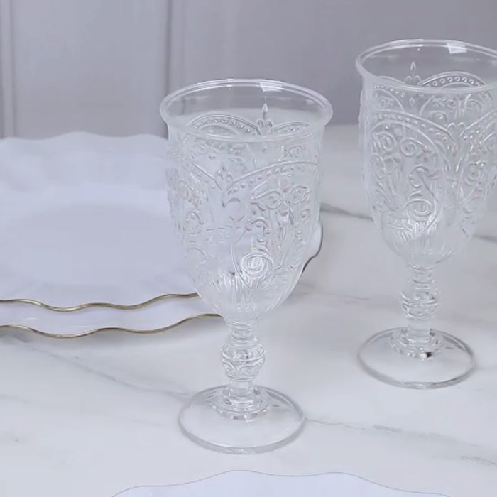 Clear plastic vintage goblets on a marble surface, ideal for wine and juice.