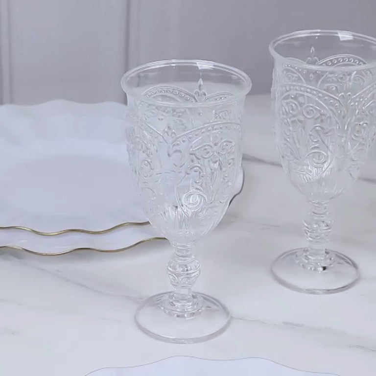 Clear plastic vintage goblets on a marble surface, ideal for wine and juice.