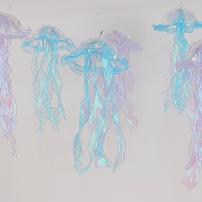 Blue purple jellyfish LED lanterns with organza ribbons for decor.
