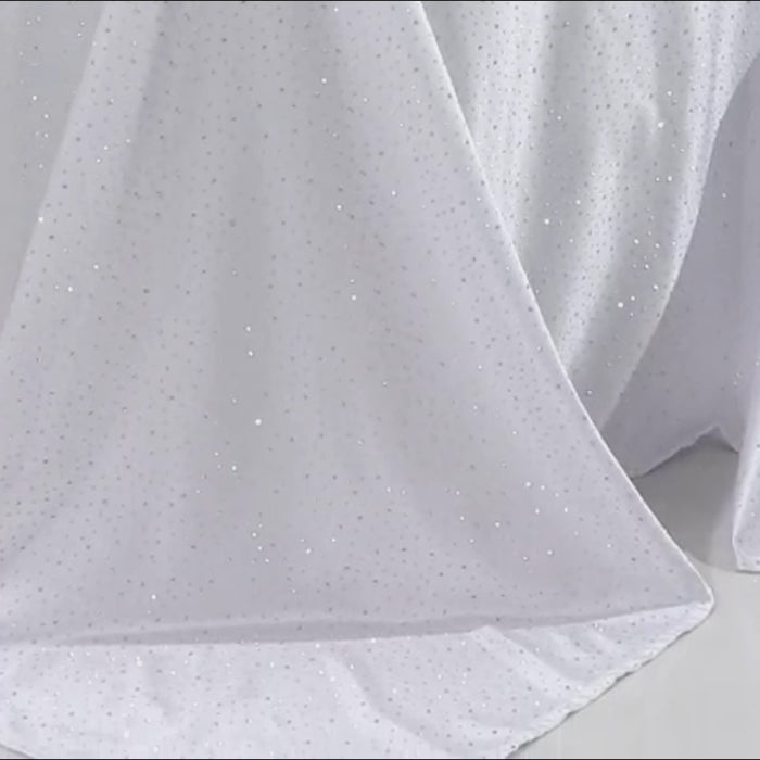 White tablecloth with rhinestone accents, wrinkle-free and stain-resistant.