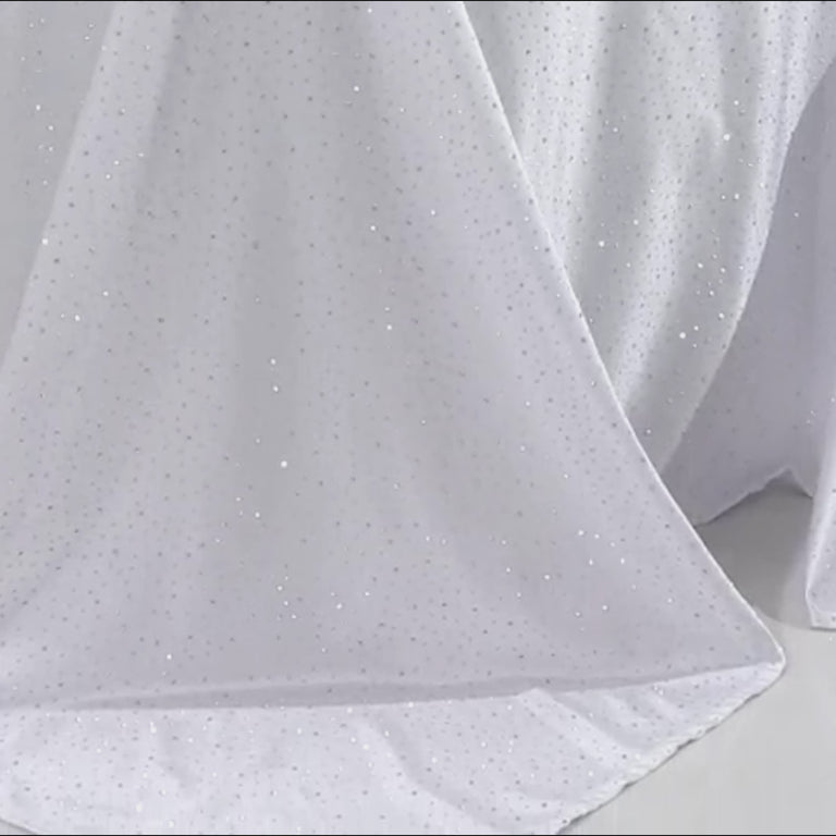 White tablecloth with rhinestone accents, wrinkle-free and stain-resistant.
