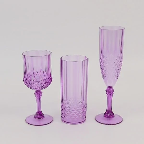 Purple shatterproof champagne flutes in crystal cut style, perfect for toasting.