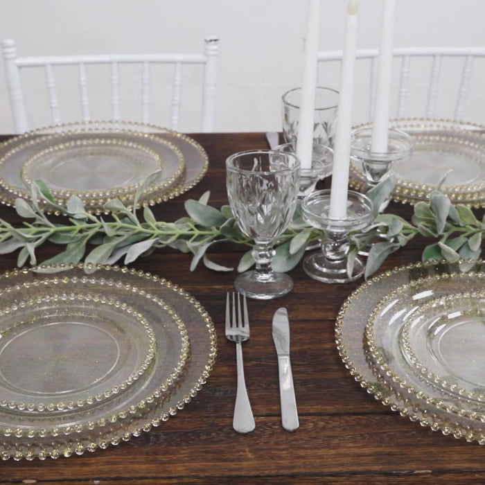 Clear gold glittered disposable dinner plates with beaded rim.