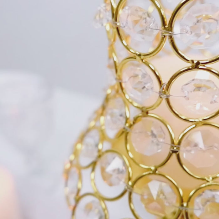 Gold centerpiece candle holder with crystal beaded shade for events.