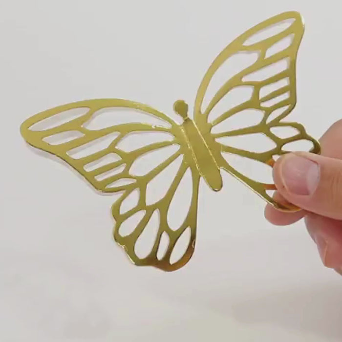 Gold butterfly place card holder with white printable card.