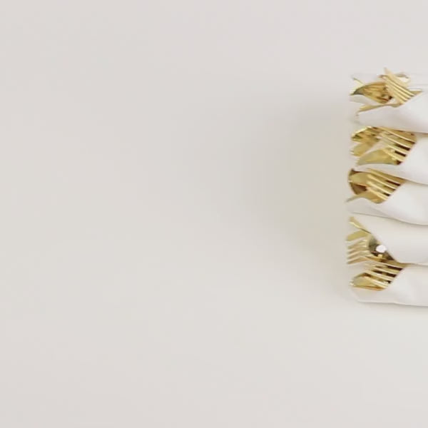 Set of 24 gold plastic silverware with pre-rolled white paper napkins.