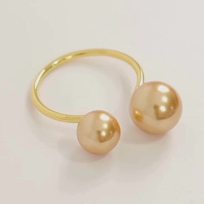 Gold pearl metal napkin ring holder for elegant dining table decor.