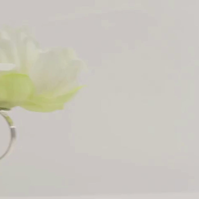 Ivory floral napkin ring with silk peony flower for table settings.