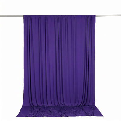 Purple draped backdrop curtain on rod for photography and events