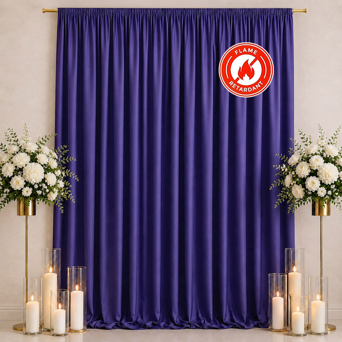 Purple flame-retardant curtain backdrop with candles and white floral arrangements