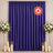 Purple flame-retardant curtain backdrop with candles and white floral arrangements