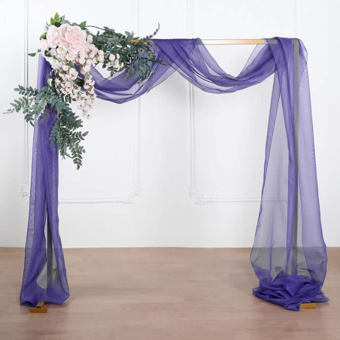 Purple drapery with floral accents for event decor